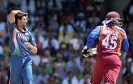 Indian cricketer Ashish Nehra(L) reacts